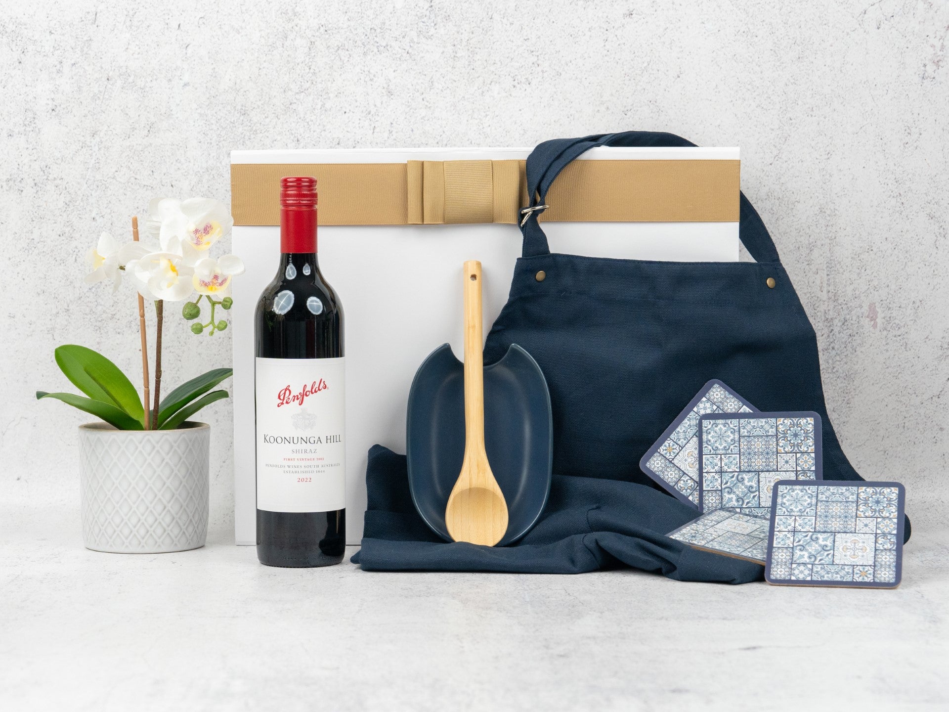 Elevate your kitchen with this Gourmet Cooking Hamper, featuring fine wine and stylish essentials. Perfect for any home chef!