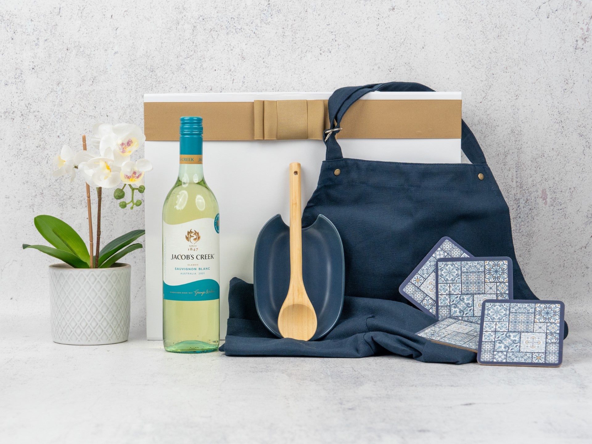 Elevate your kitchen with this Gourmet Cooking Hamper, featuring fine wine and stylish essentials. Perfect for any home chef!