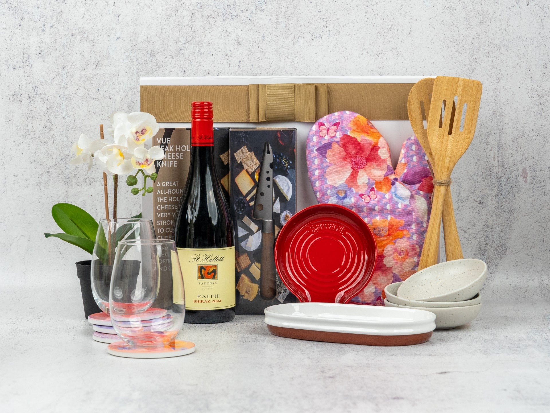 Elevate your kitchen and dining with this Gourmet Essentials Hamper, featuring premium wines and stylish accessories.