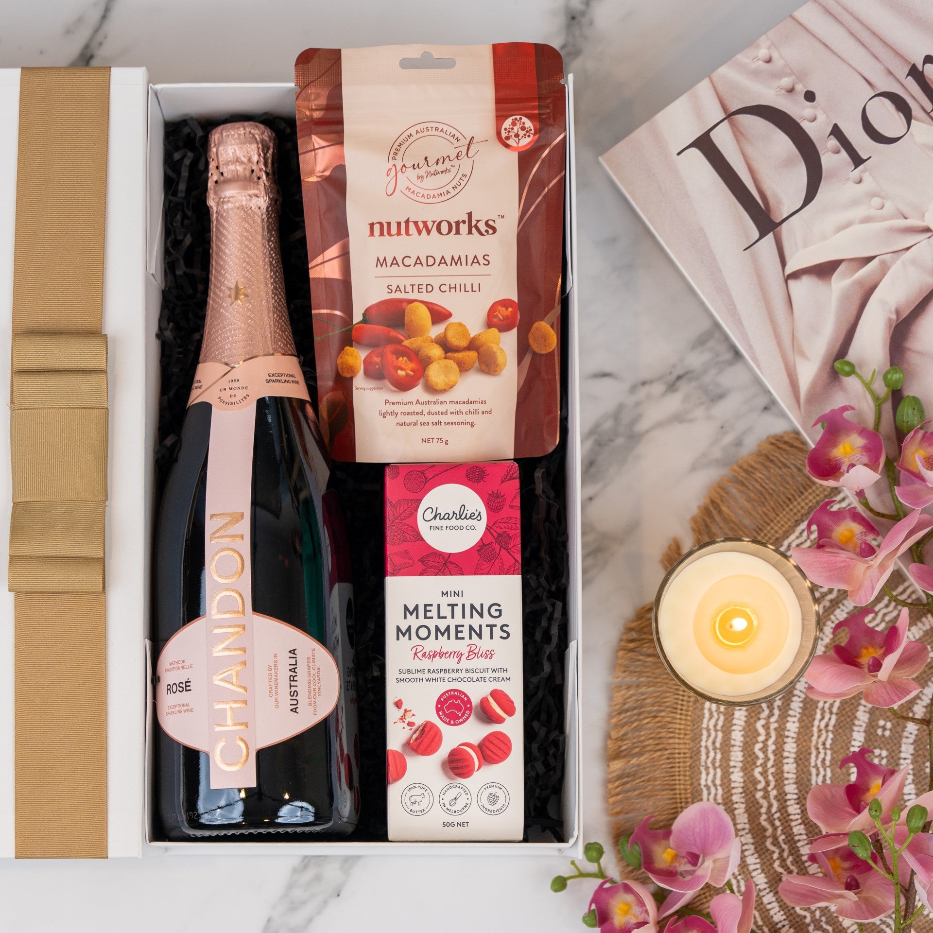 Indulge in the Chandon Rosé Delights Hamper: luxurious raspberry treats and spicy chilli macadamias. Perfect for celebrations!